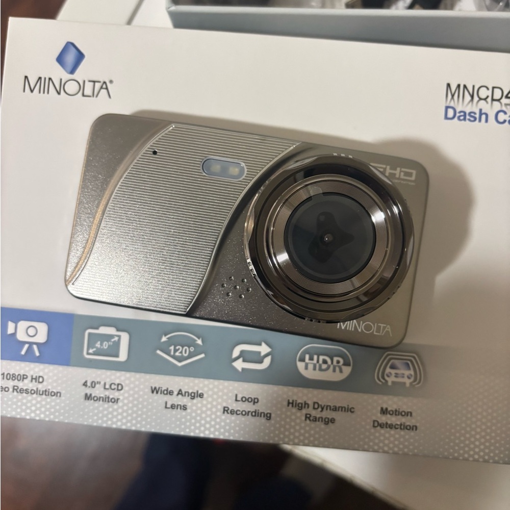 New* Silver Dash Camera with Compact Design and Circular Lens
